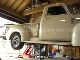 The truck on axle stands.