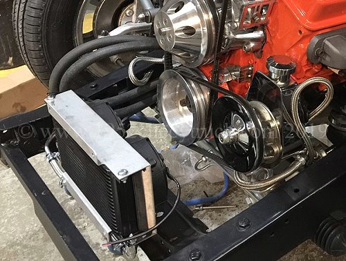 Transmission cooler in the air flow