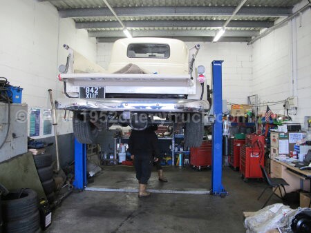 1952 Chevy truck fitting a new transmission.