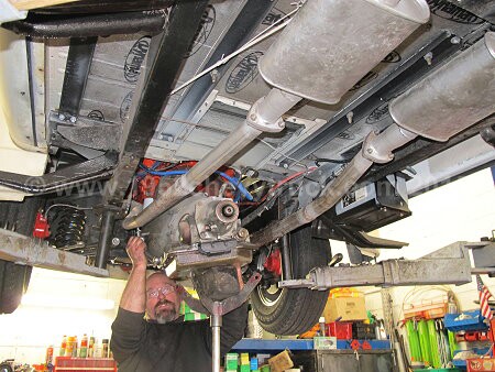 1952 Chevy truck fitting a new transmission.