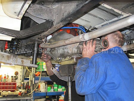 1952 Chevy truck fitting a new transmission.