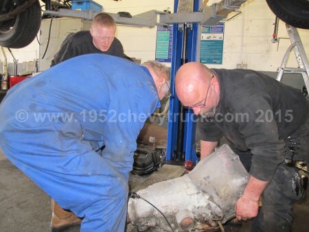 1952 Chevy truck fitting a new transmission.