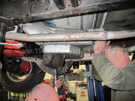 1952 Chevy truck fitting a new transmission.