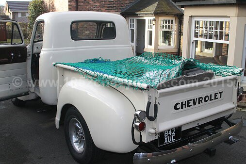 1952 Chevy truck fitting a new transmission.